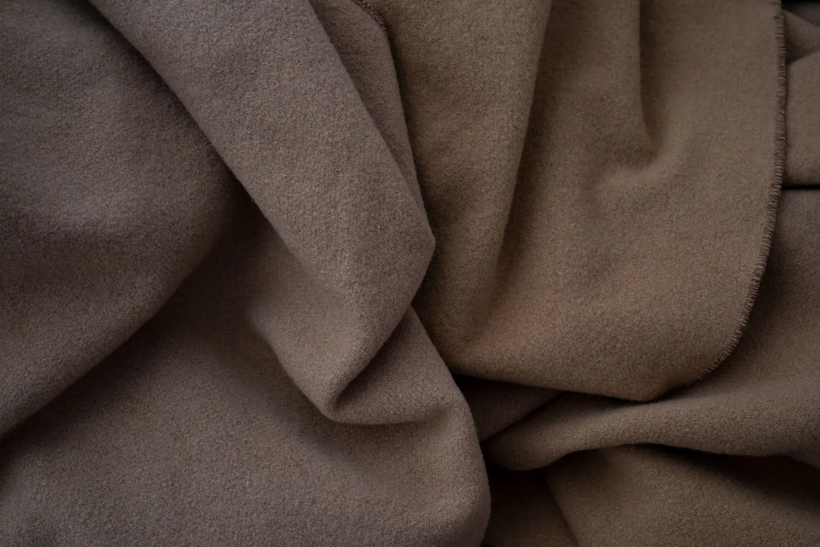 Soft draped brown woollen cloth.